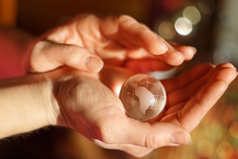 Earth globe in hands. The concept of ecological safety of the earth.