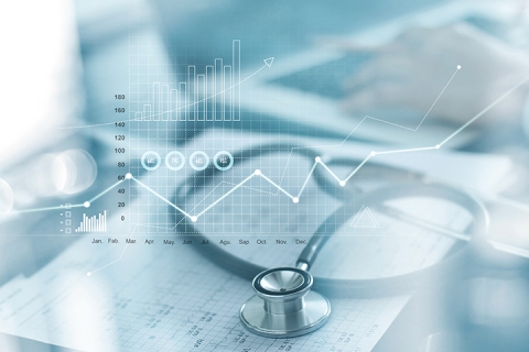 Double exposure graphs over stethoscope and medical equipment