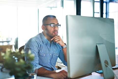 employee looking at computer screen