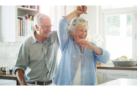 elderly people dancing in a kitchen