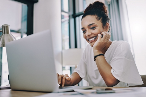 Happy woman working on her laptop