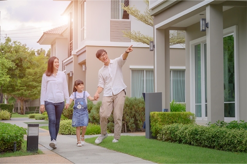 Young family walking around townhouse subdivison