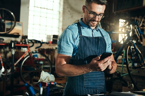 Small business owner using his tablet