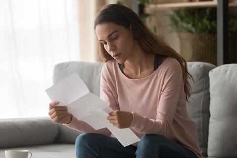 woman opening mail