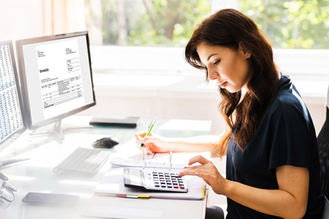 Woman processing invoice