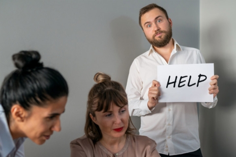 man with a help sign