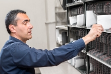 man sorting mail in mailroom